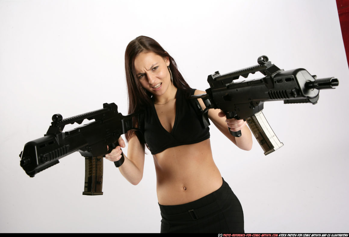 A woman in an action pose holding two submachine guns with a menacing look