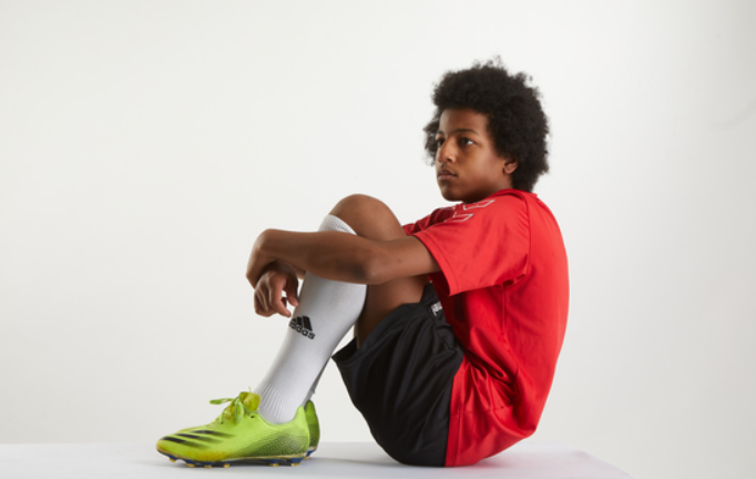 Young model Kofi in football dress